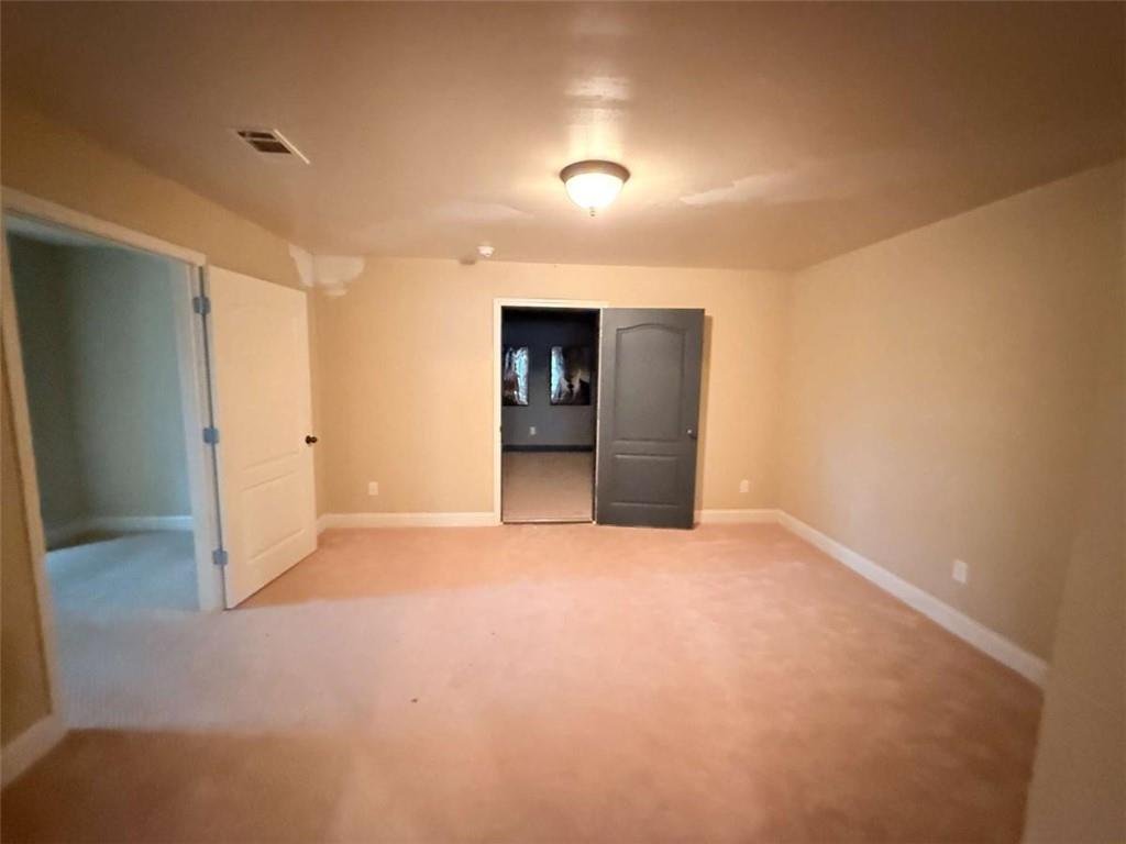 75 Cannonade Court Covington, GA 30016 - Photo 8 of 20 a view of an empty room with closet and bathroom