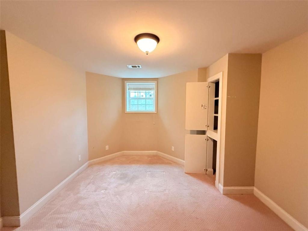 75 Cannonade Court Covington, GA 30016 - Photo 9 of 20 a view of an empty room with a window