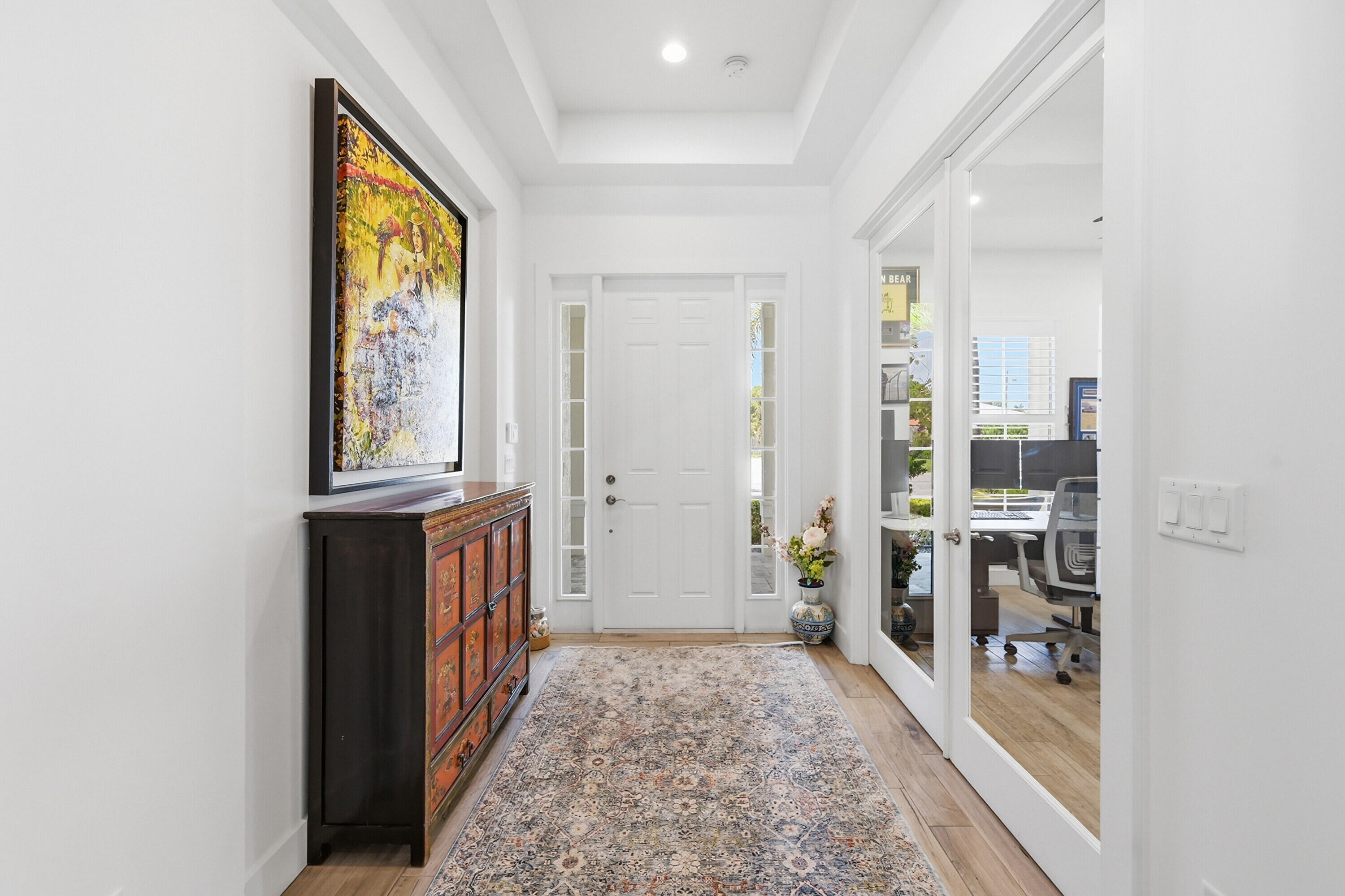 2840 Northeast 22nd Avenue Lighthouse Point, FL 33064 - Photo 11 of 55 a view of hallway with wooden floor and a rug