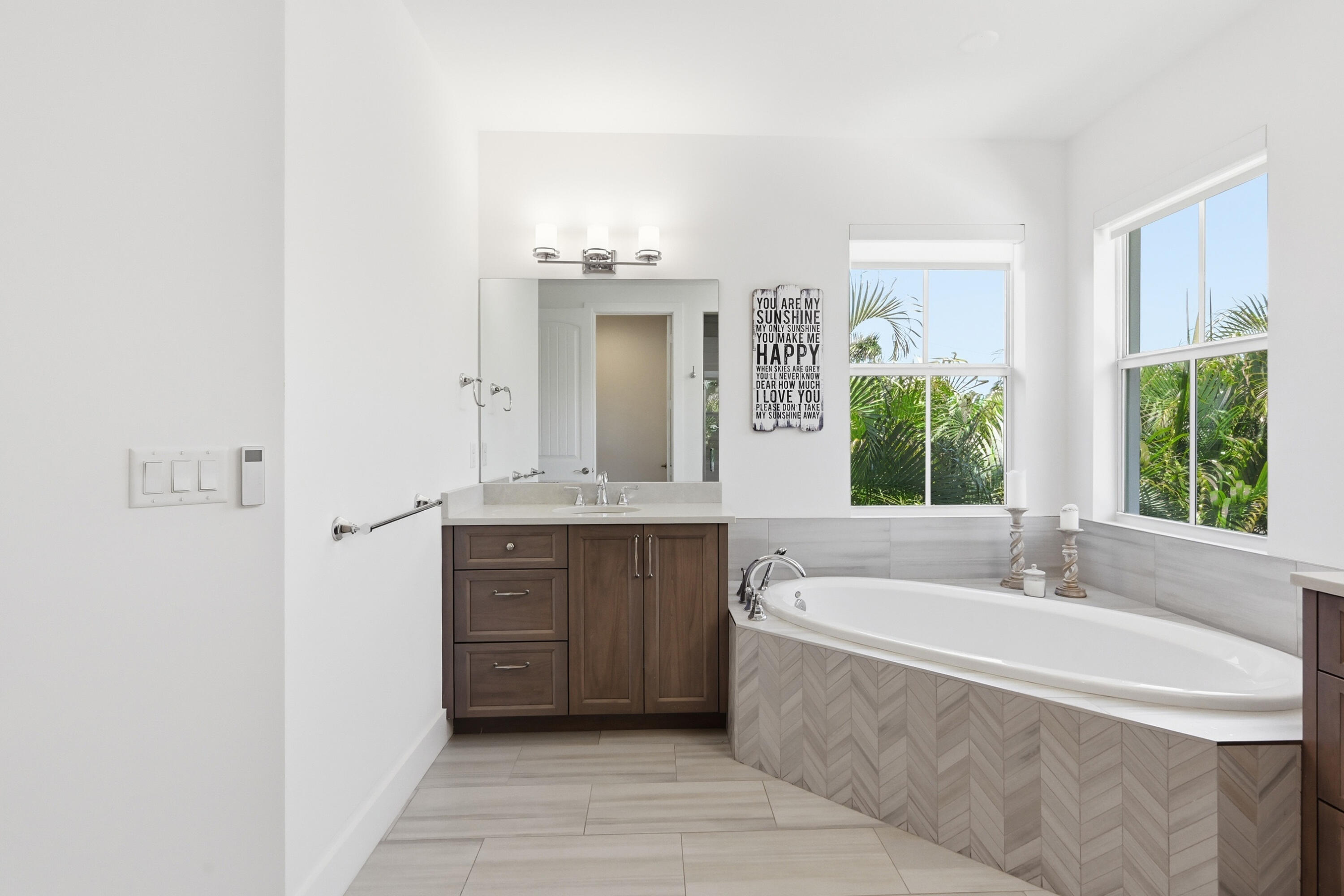 2840 Northeast 22nd Avenue Lighthouse Point, FL 33064 - Photo 24 of 55 a spacious bathroom with a tub sink and mirror