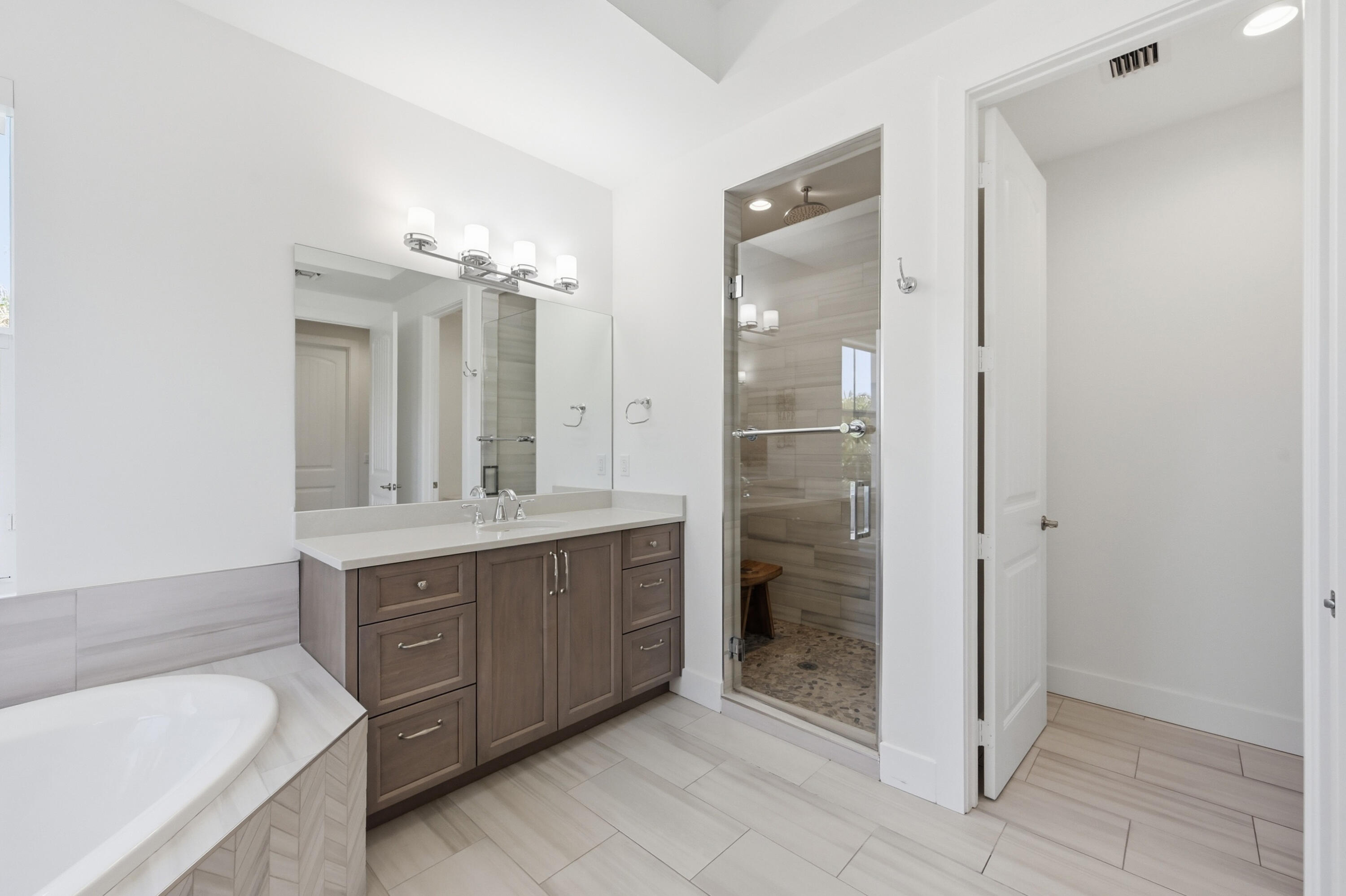 2840 Northeast 22nd Avenue Lighthouse Point, FL 33064 - Photo 25 of 55 a bathroom with a double vanity sink a toilet a mirror and shower