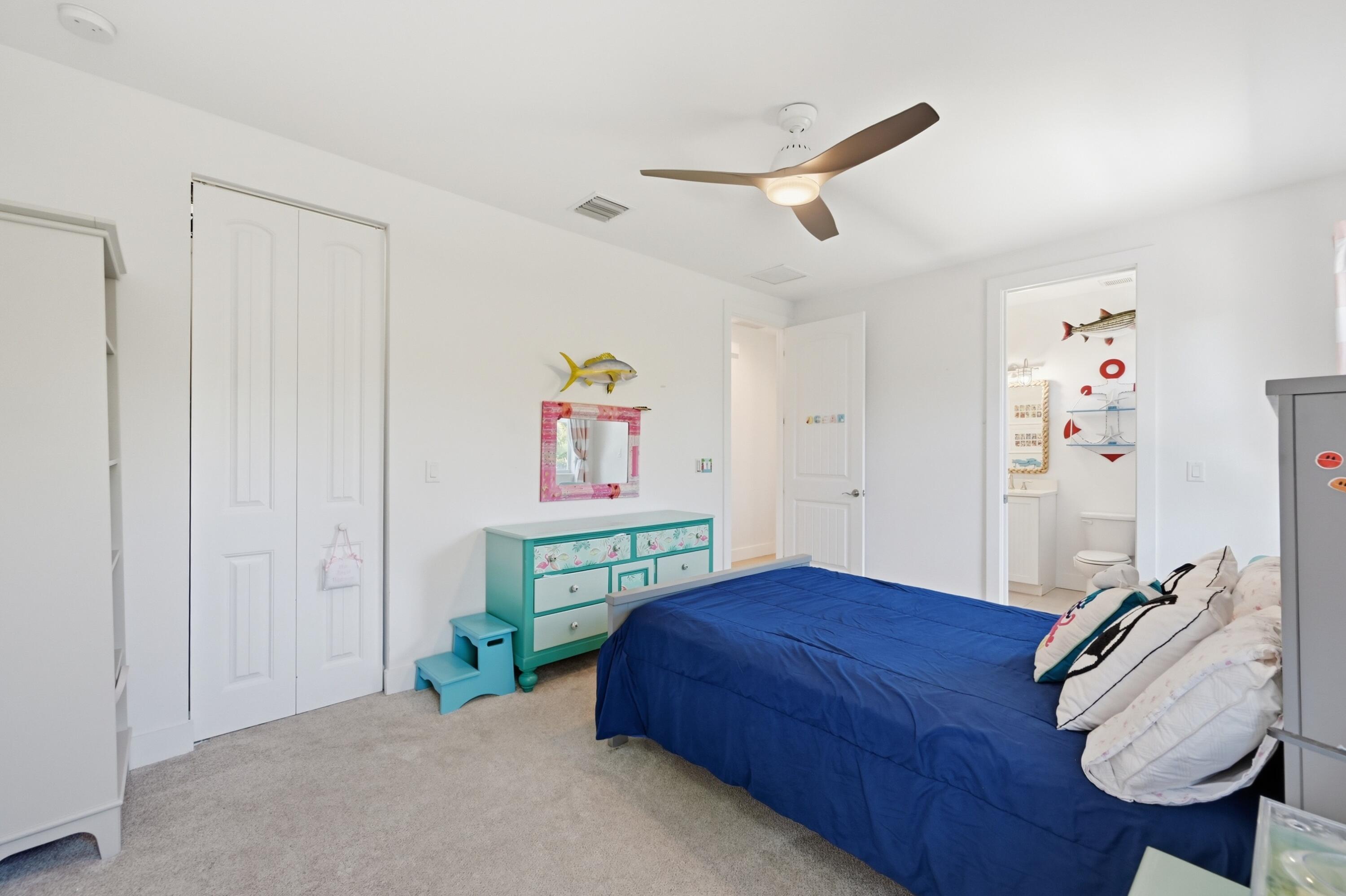 2840 Northeast 22nd Avenue Lighthouse Point, FL 33064 - Photo 34 of 55 a bedroom with a bed and a wooden floor