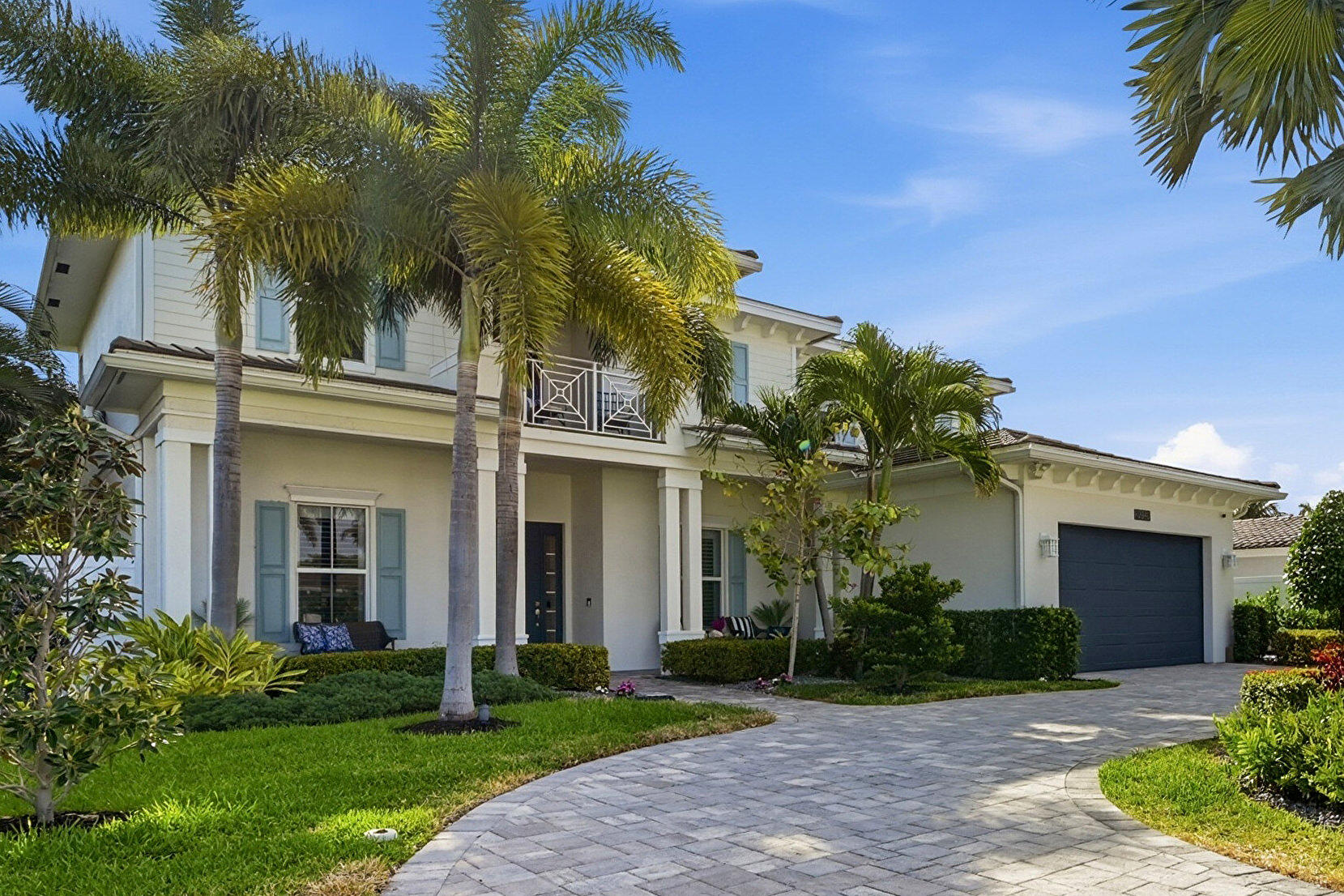 2840 Northeast 22nd Avenue Lighthouse Point, FL 33064 - Photo 46 of 55 front view of a house with a garden
