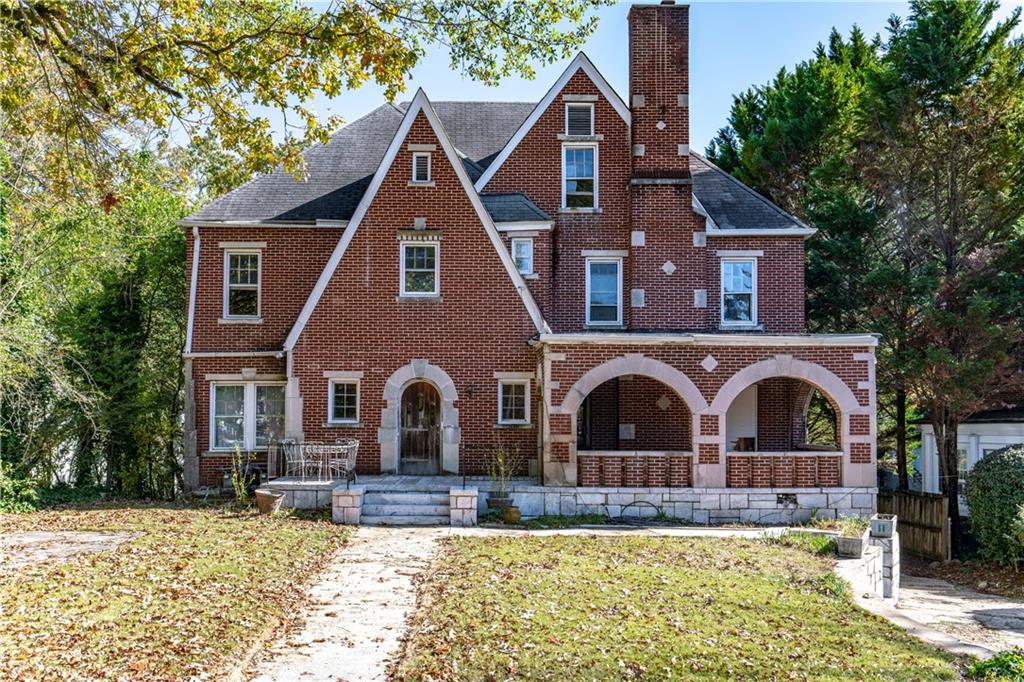 1225 Clifton Rd N East Atlanta, GA 30307 - Photo 1 of 1 a front view of a house with a yard