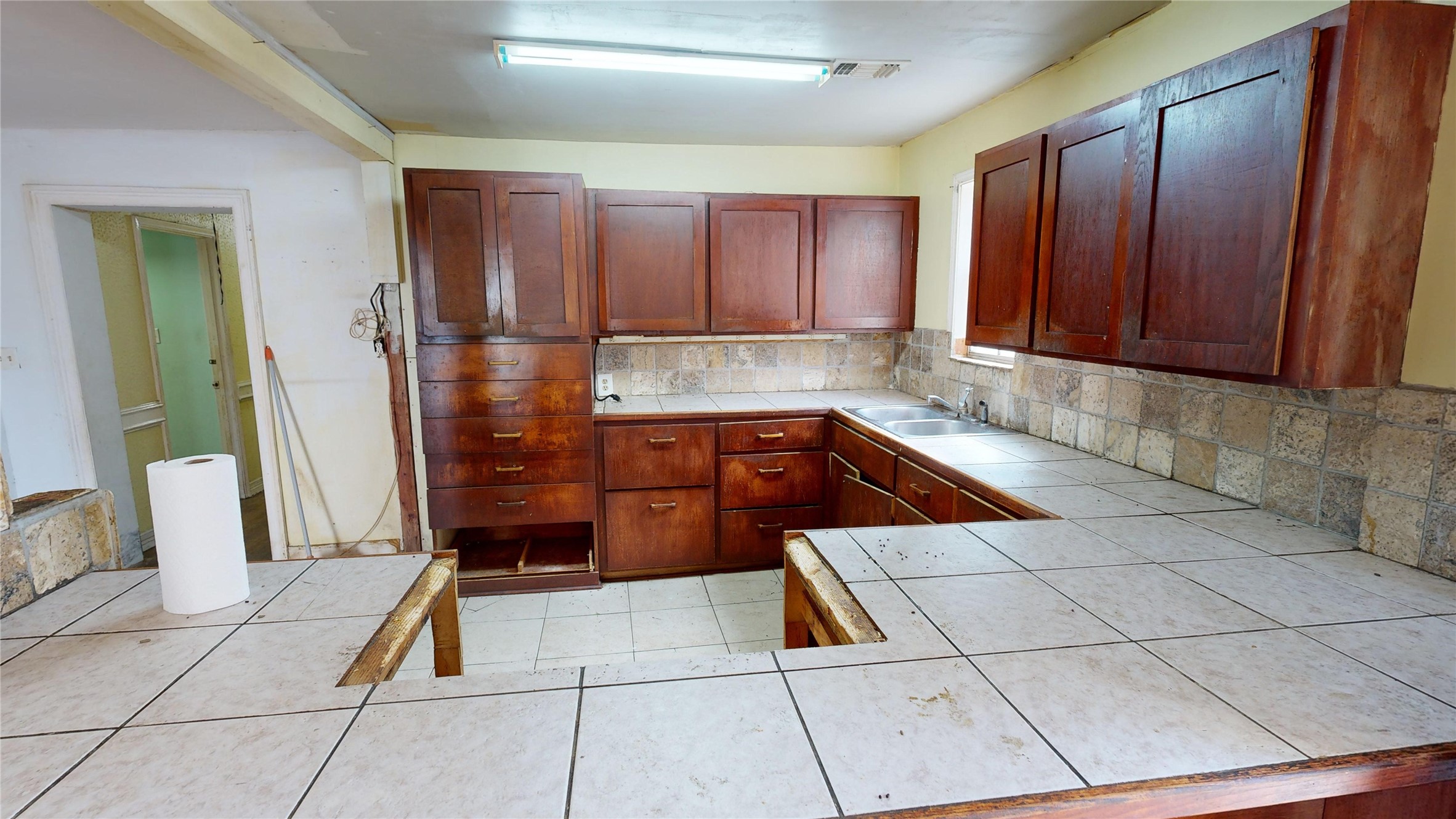 1315 Heslep Street Houston, TX 77009 - Photo 7 of 21 a kitchen with stainless steel appliances granite countertop a refrigerator and a sink