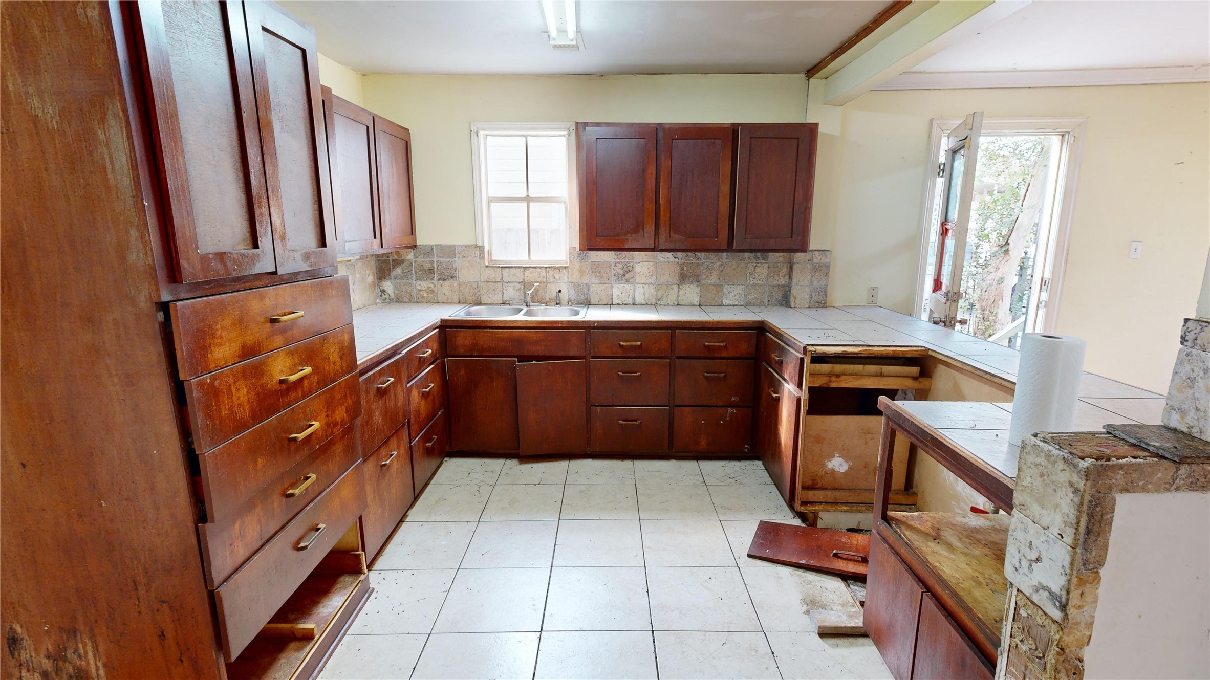 1315 Heslep Street Houston, TX 77009 - Photo 8 of 21 a kitchen with stainless steel appliances granite countertop a sink stove and cabinets