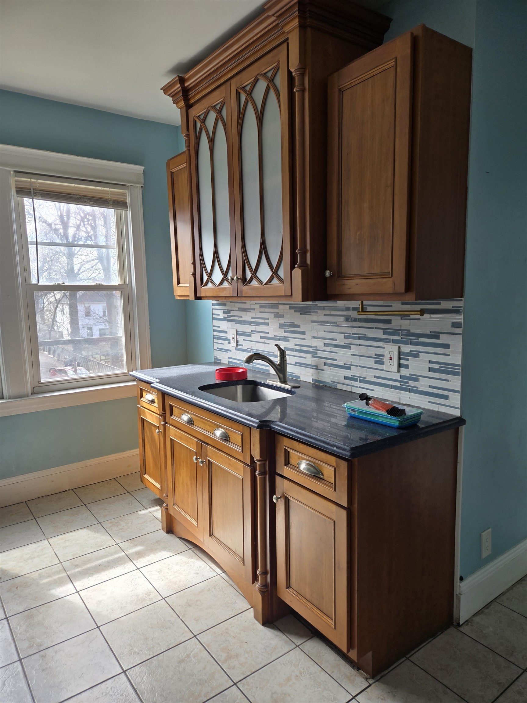 1205 73rd Street, Unit 2 North Bergen, NJ 07047 - Photo 2 of 8 a kitchen with stainless steel appliances granite countertop a sink and a stove