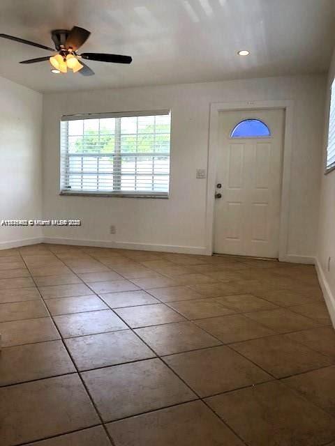 904 Southwest 7th Terrace, Unit 1 Hallandale Beach, FL 33009 - Photo 4 of 11 a view of an empty room with a window