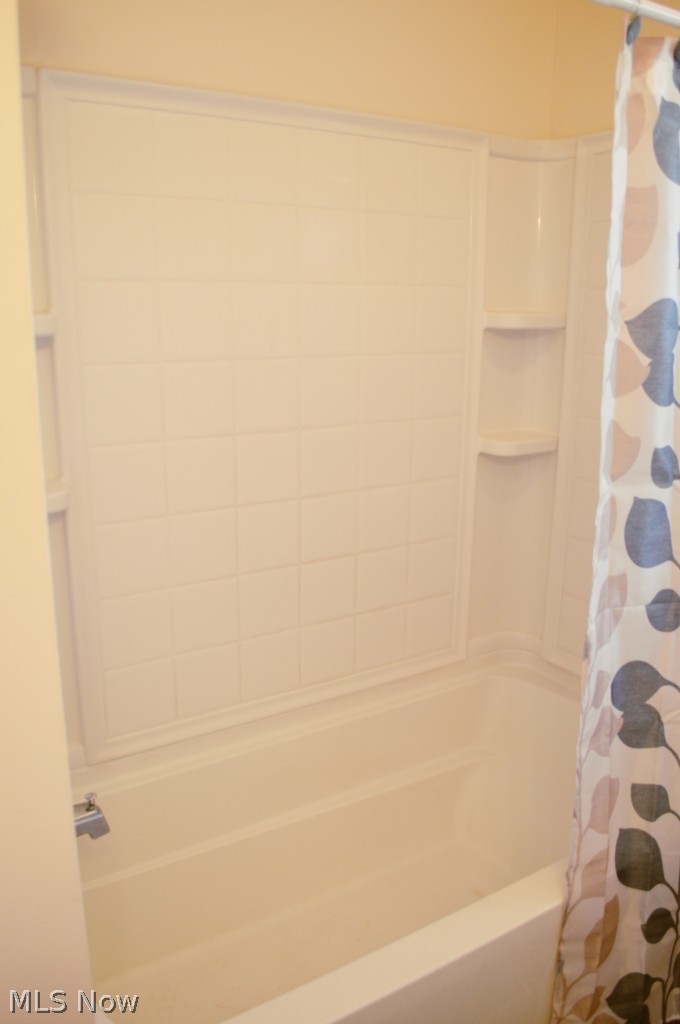 1712 Meister Road Lorain, OH 44053 - Photo 12 of 17 New tub surround & extra deep tub.