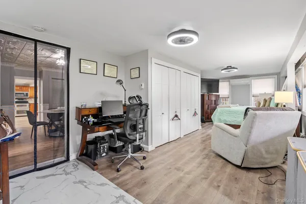 a view of a livingroom with furniture and a window