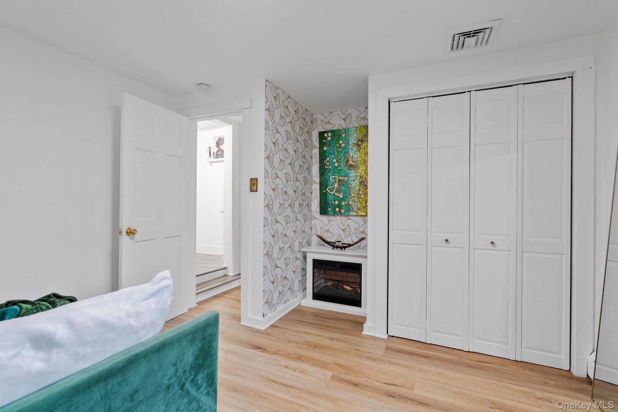 168 Fostertown Road Newburgh, NY 12550 - Photo 26 of 37 a view of a hallway with wooden floor and a sink