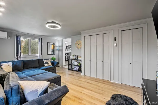 a bedroom with a bed window and table