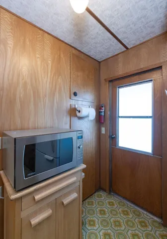 a kitchen with a stove and a microwave