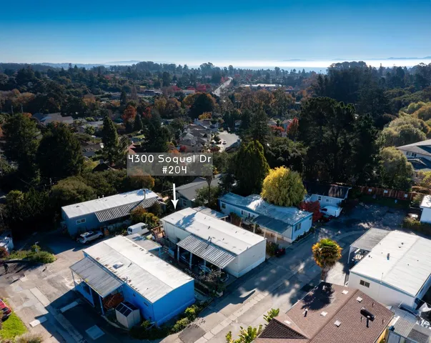 an aerial view of a house with city view