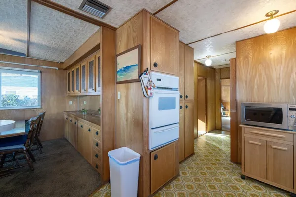 a kitchen with stainless steel appliances a refrigerator and a stove