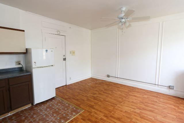 4735 North Beacon Street, Unit 211 Chicago, IL 60640 - Photo 3 of 11 a view of empty room with wooden floor