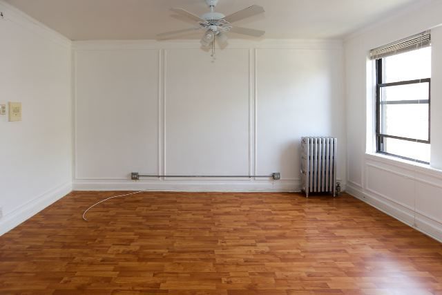 4735 North Beacon Street, Unit 211 Chicago, IL 60640 - Photo 4 of 11 a view of an empty room with a window