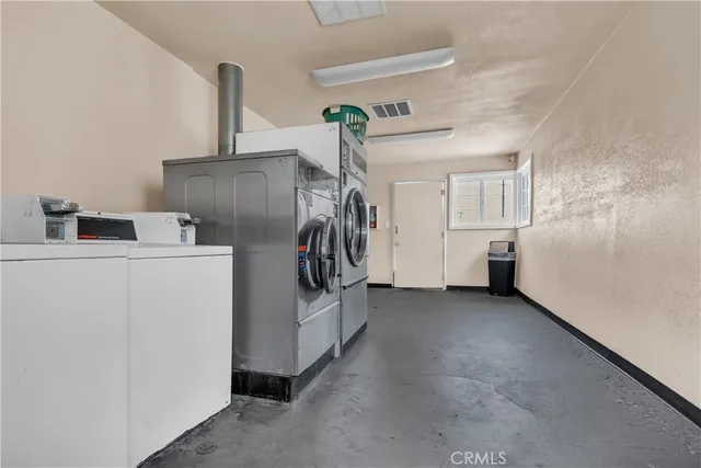 a childrens park with lots of swings and slides