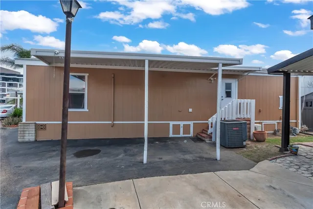 a front view of a house with a barbeque