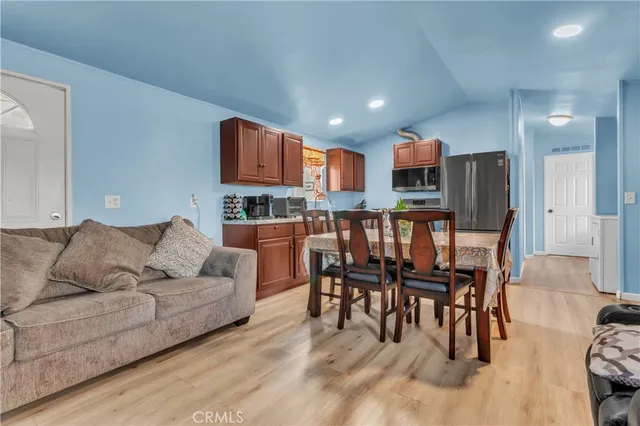 a kitchen with stainless steel appliances granite countertop a refrigerator stove and sink