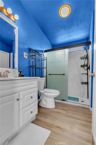 a bathroom with a toilet and a shower