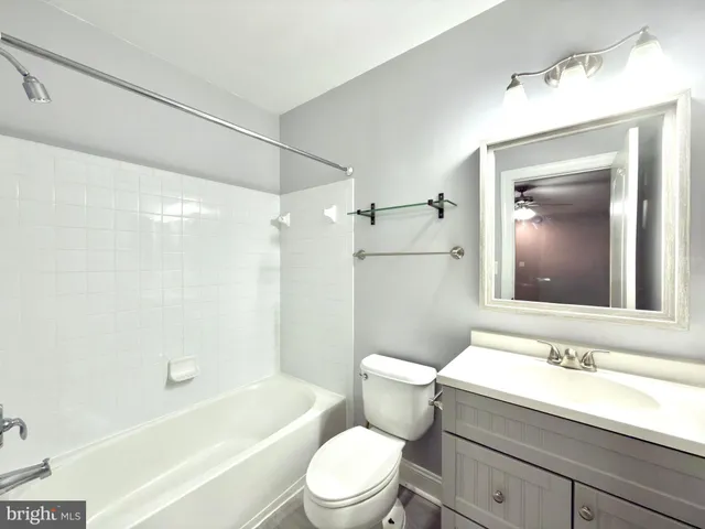 a bathroom with a sink a toilet and a bathtub