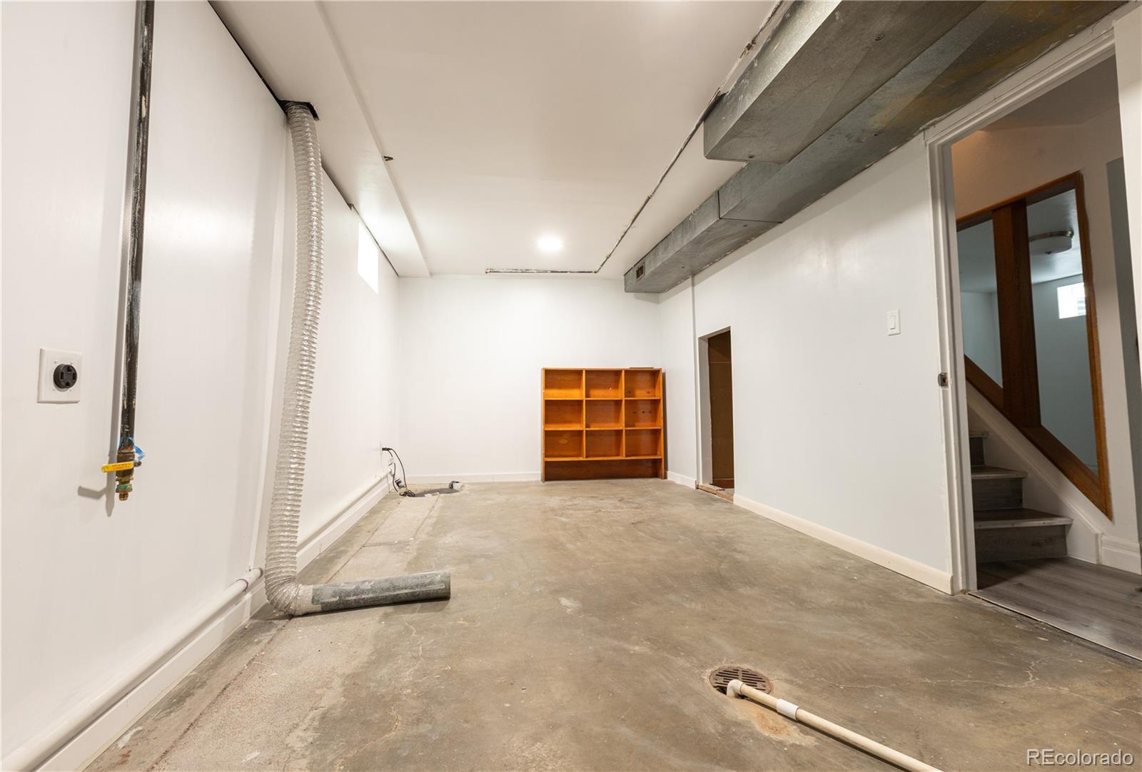 8243 Adams Way Denver, CO 80221 - Photo 25 of 27 a view of a livingroom with an empty space