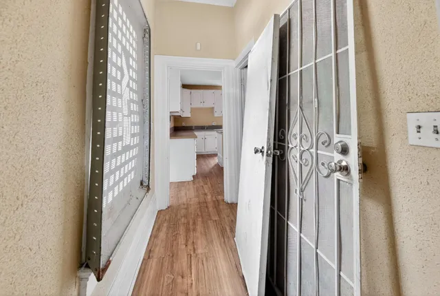 a view of a bathroom from a hallway
