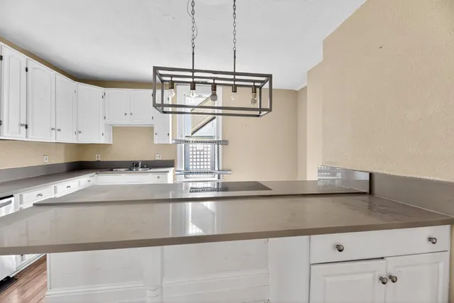 a kitchen with a sink and cabinets