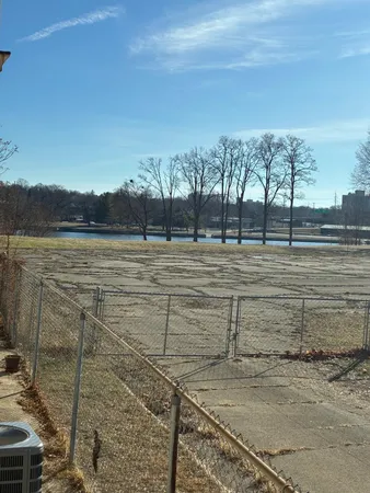a view of a yard with an ocean view