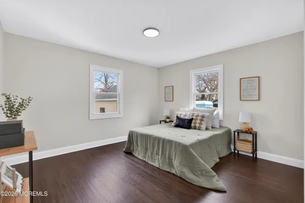 a bedroom with a bed and a table