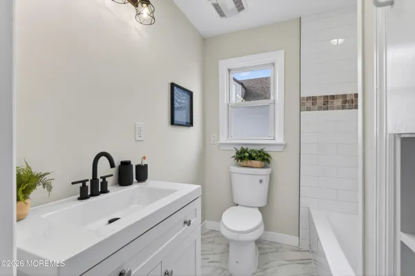 a bathroom with a sink and a toilet