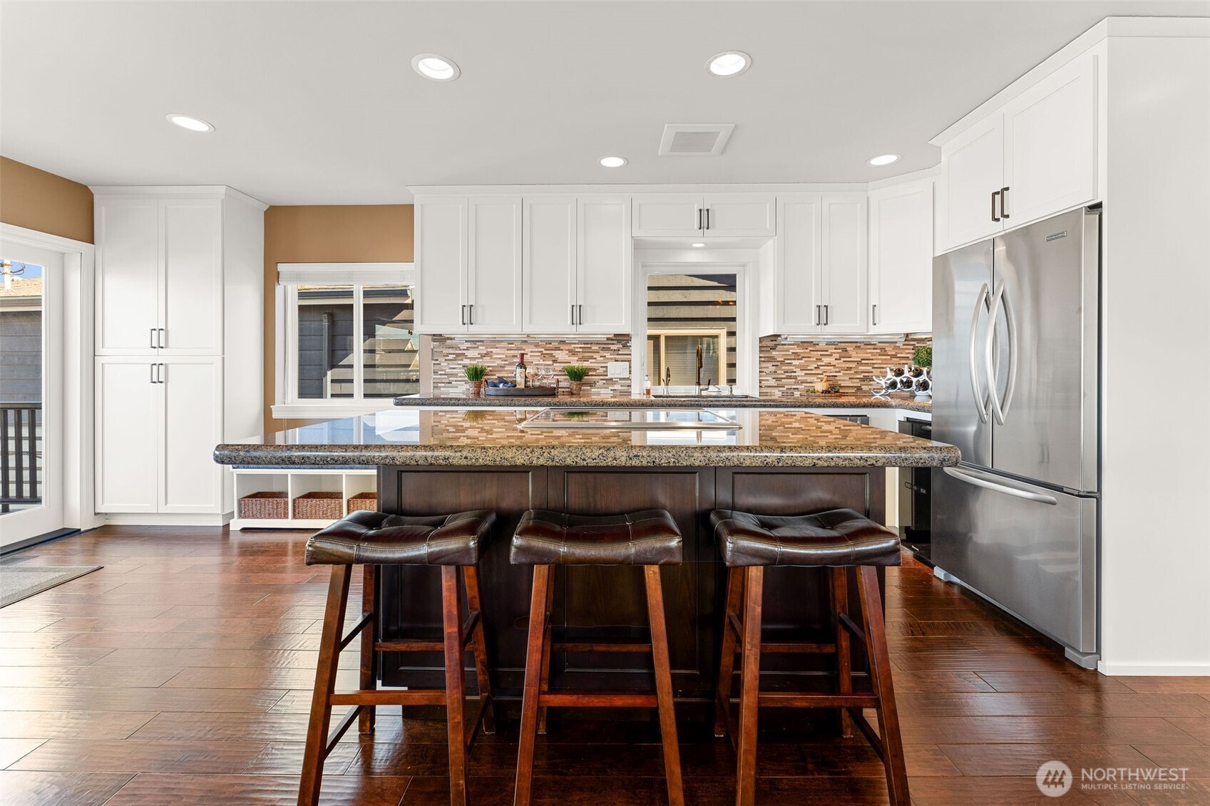 781 Maple Grove Road Camano Island, WA 98282 - Photo 11 of 39 a kitchen with stainless steel appliances a stove a sink refrigerator and cabinets