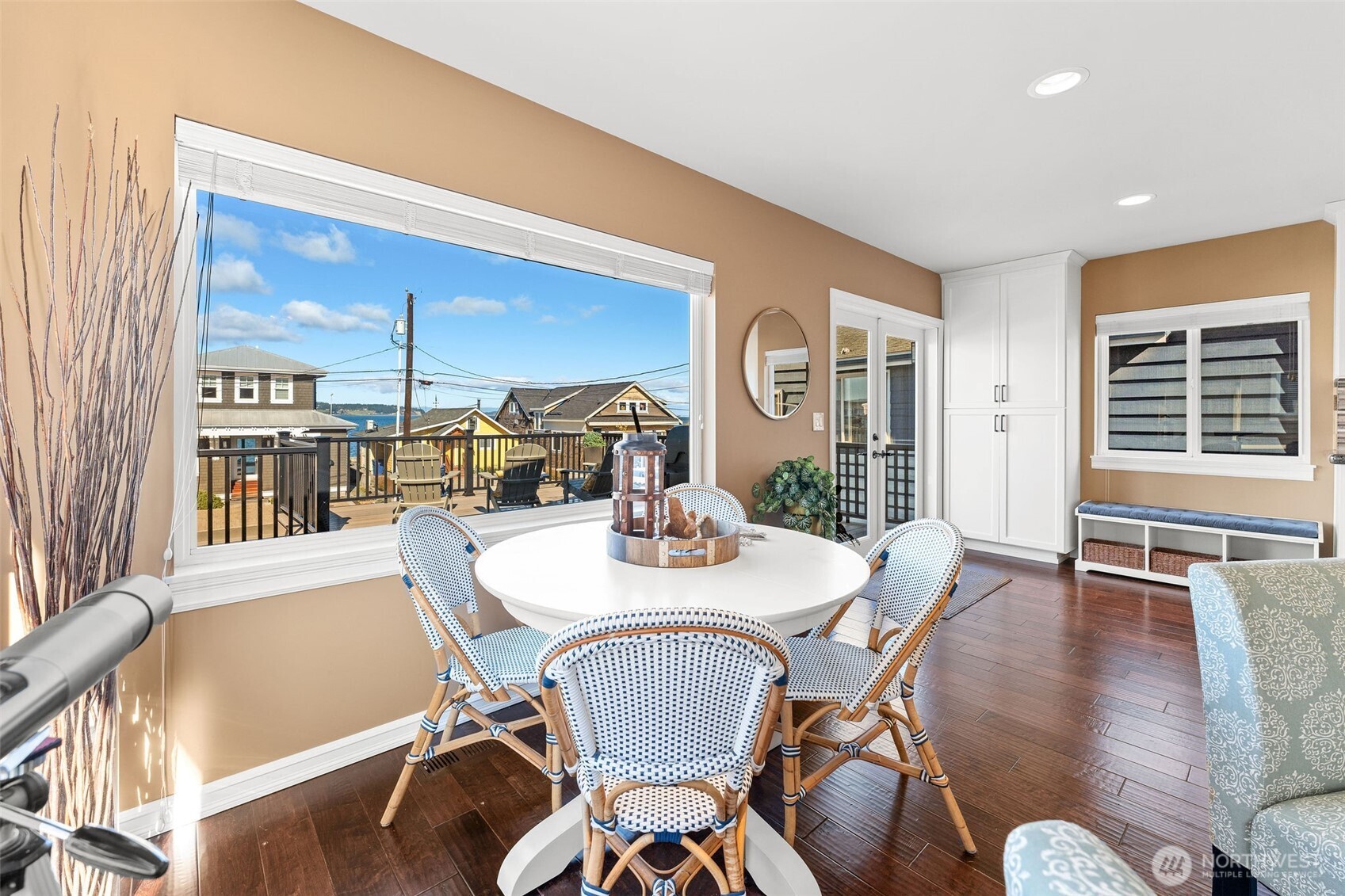 781 Maple Grove Road Camano Island, WA 98282 - Photo 15 of 39 a view of a dining room with furniture window and wooden floor