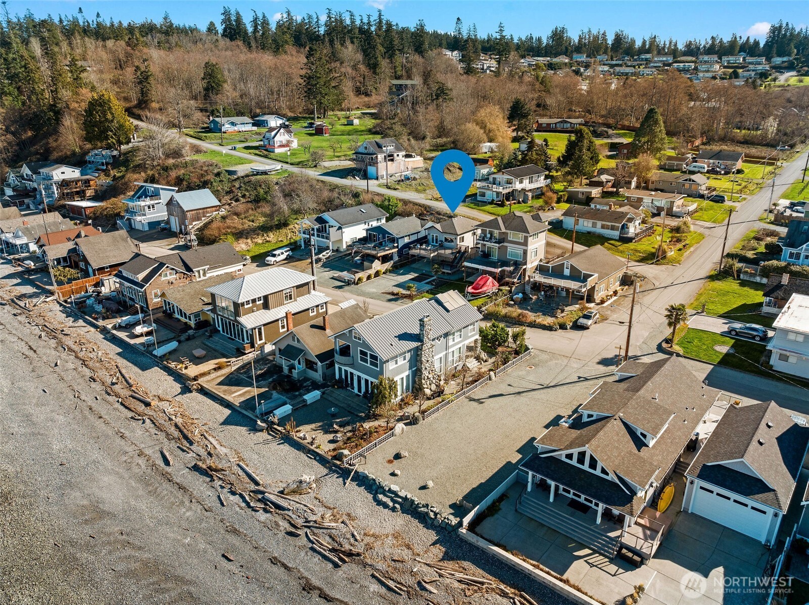 781 Maple Grove Road Camano Island, WA 98282 - Photo 3 of 39 an aerial view of a city with lots of residential buildings and ocean view