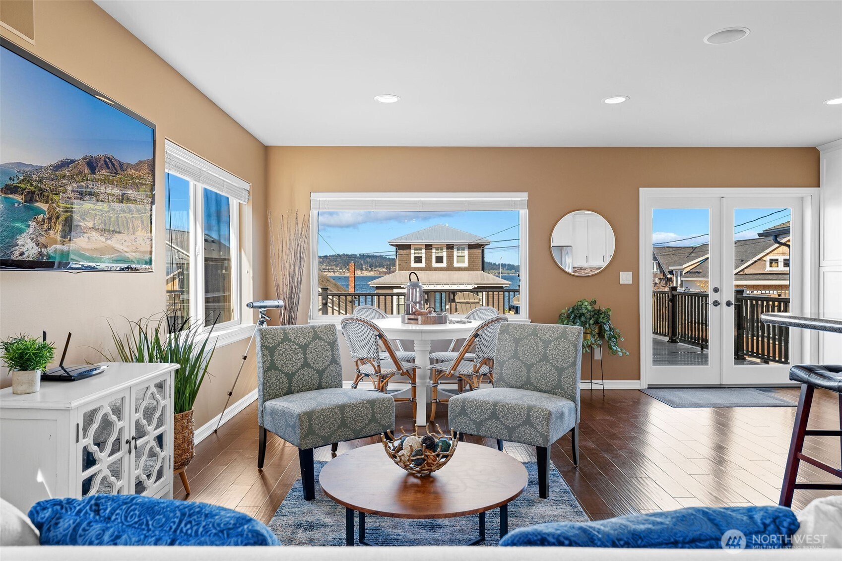 781 Maple Grove Road Camano Island, WA 98282 - Photo 5 of 39 a living room with fireplace furniture and a large window
