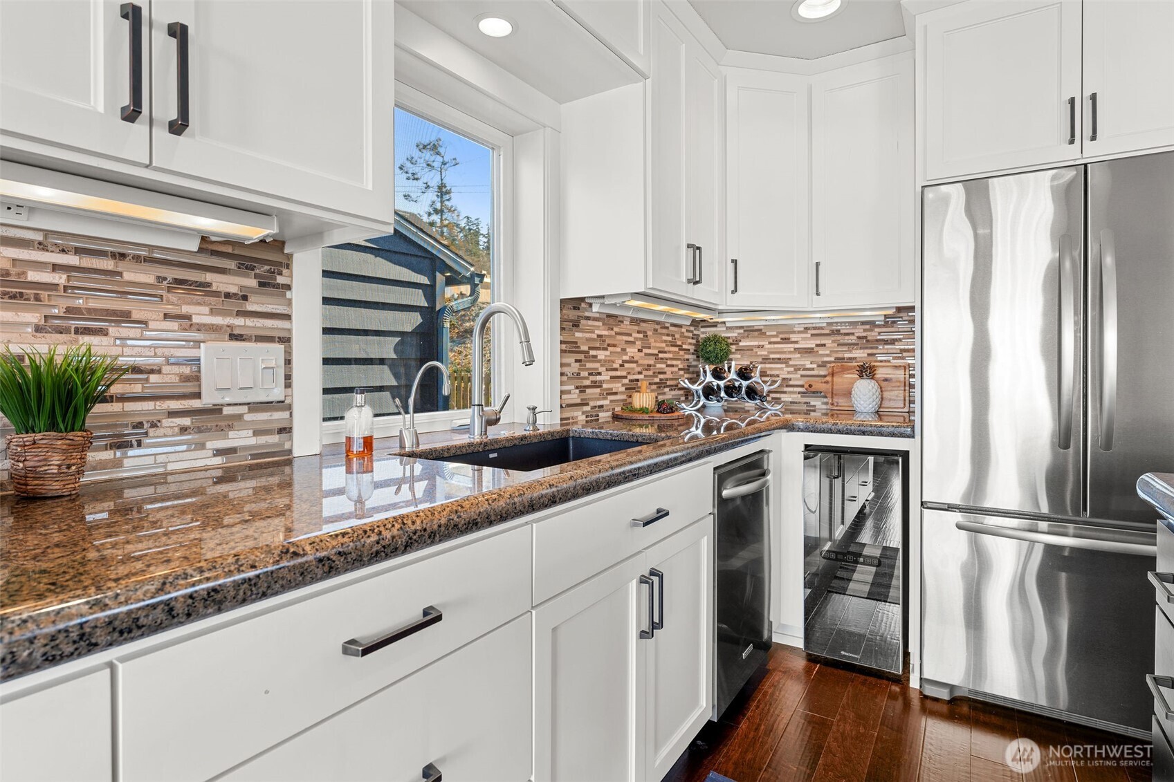 781 Maple Grove Road Camano Island, WA 98282 - Photo 9 of 39 a kitchen with stainless steel appliances granite countertop a refrigerator and a sink