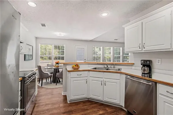 a kitchen with lots of counter top space and dining table