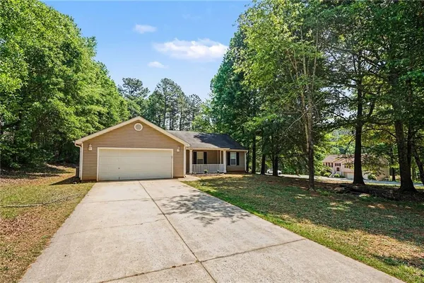 front view of a house with a yard