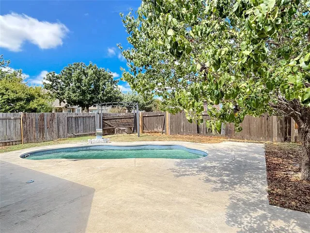 a swimming pool with outdoor seating