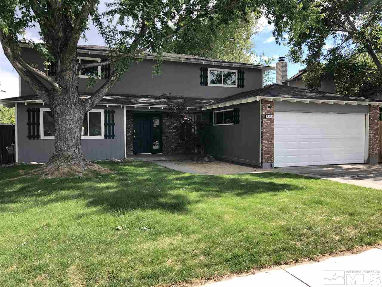 a view of house with yard