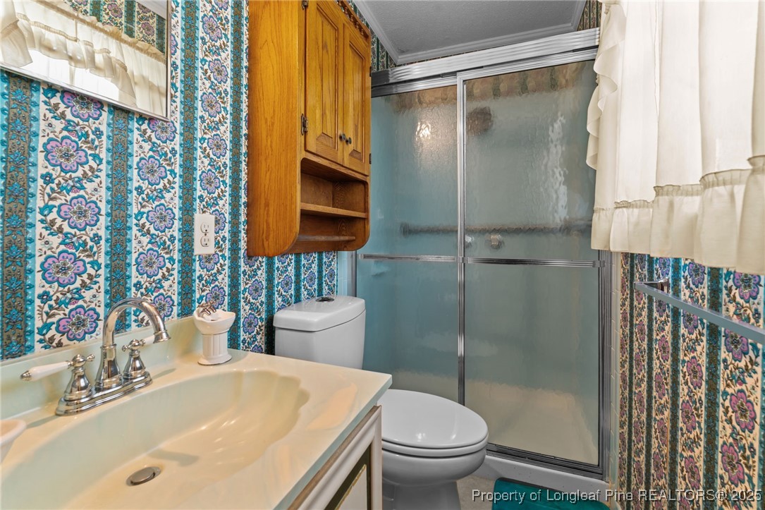 255 Sarason Place Vass, NC 28394 - Photo 13 of 50 a bathroom with a sink toilet and shower