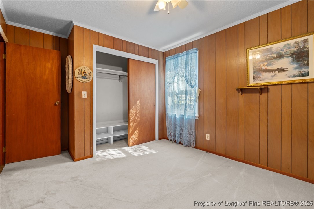 255 Sarason Place Vass, NC 28394 - Photo 17 of 50 an empty room with windows closet and bathroom