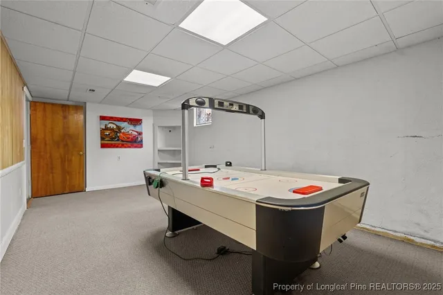 a view of a room with a door and a window