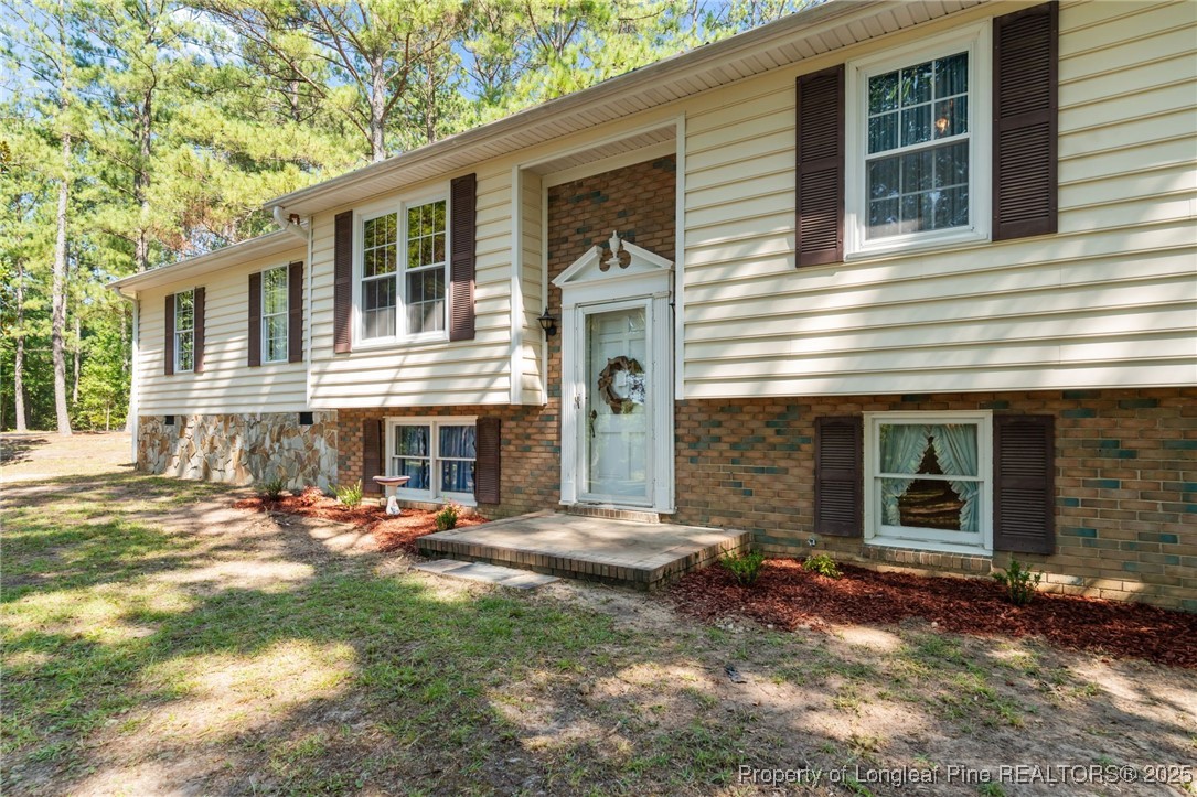 255 Sarason Place Vass, NC 28394 - Photo 3 of 50 a backyard of a house with outdoor seating