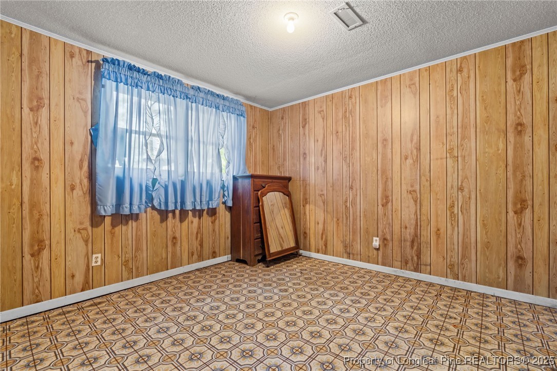 255 Sarason Place Vass, NC 28394 - Photo 31 of 50 a view of a room with a door and a window