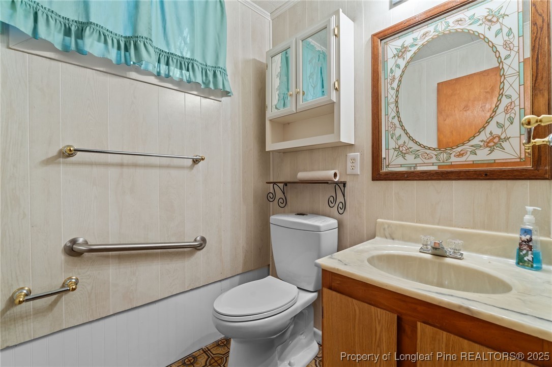 255 Sarason Place Vass, NC 28394 - Photo 33 of 50 a bathroom with a sink and a toilet