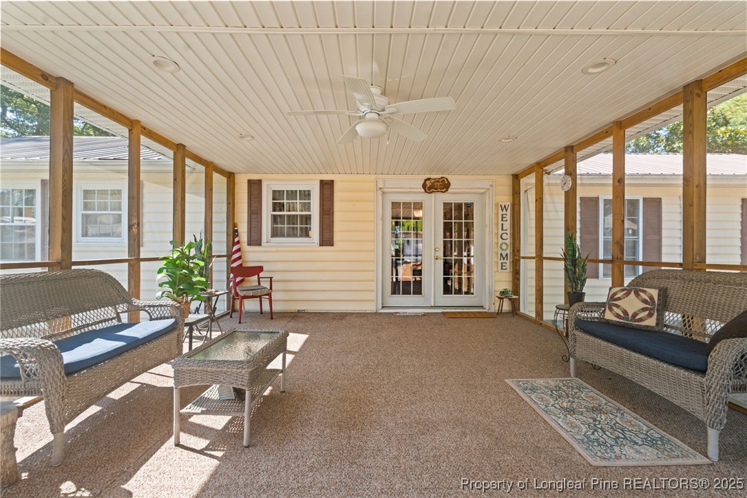 255 Sarason Place Vass, NC 28394 - Photo 38 of 50 a living room with furniture and large windows