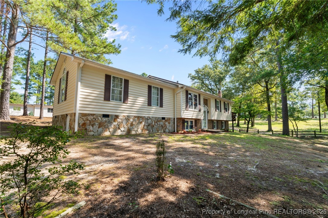 255 Sarason Place Vass, NC 28394 - Photo 48 of 50 a front view of a house with a yard