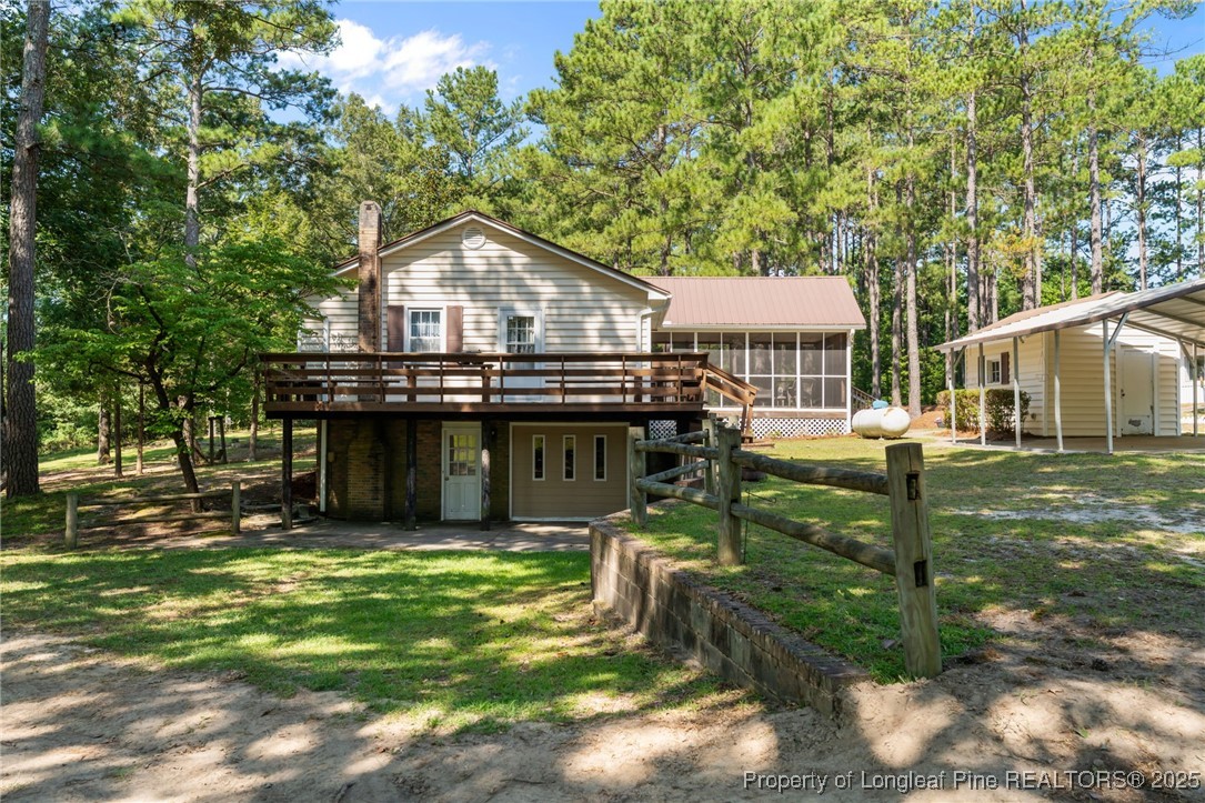255 Sarason Place Vass, NC 28394 - Photo 49 of 50 a view of a house with backyard and sitting area